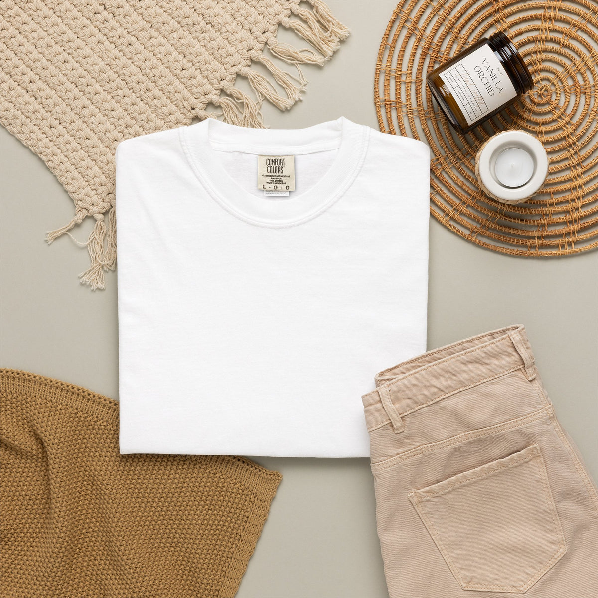 Japanese Speed Car Tee in White, folded shirt flat lay on a woven mat